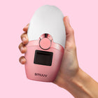 Mave IPL Hair Removal device held in a hand against a pink background